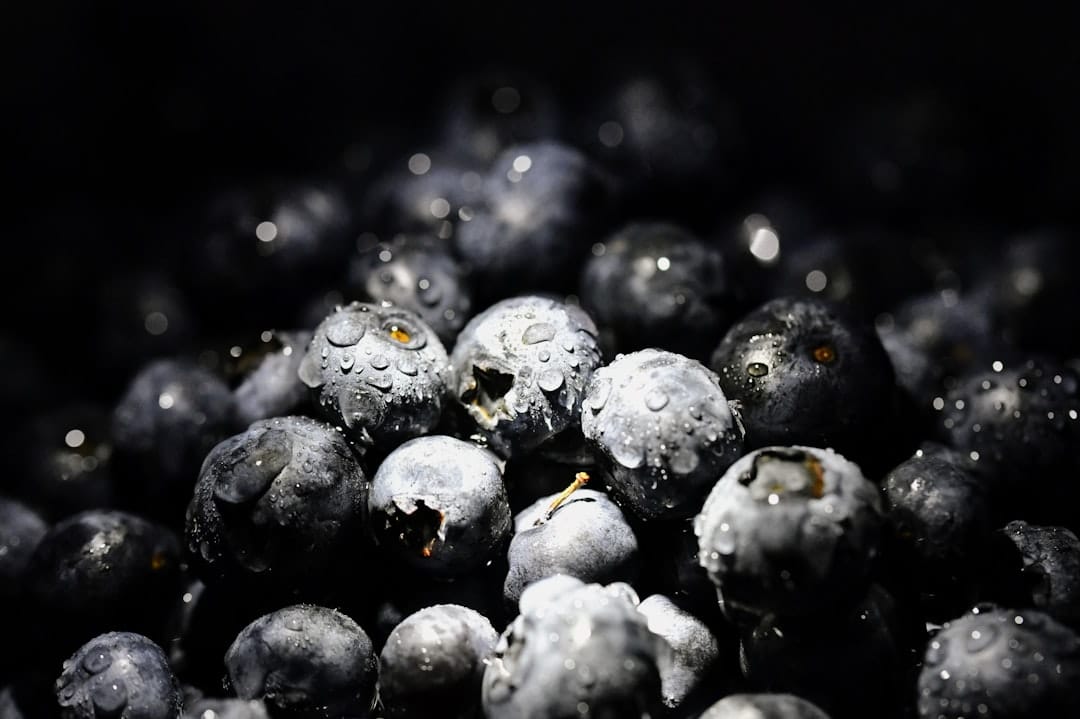 Fresh blueberries covered in water droplets representing the Blueberry Mac strain flavour profile