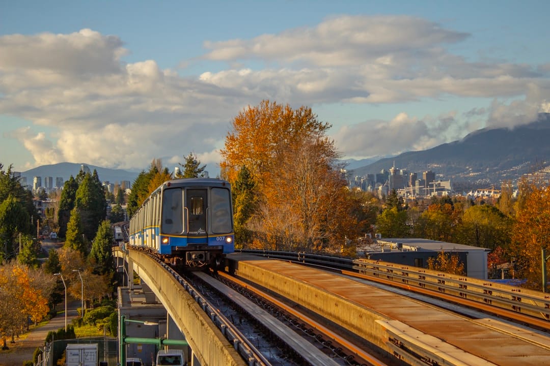 SkyTrain train traveling through lush forest in Metro Vancouver British Columbia