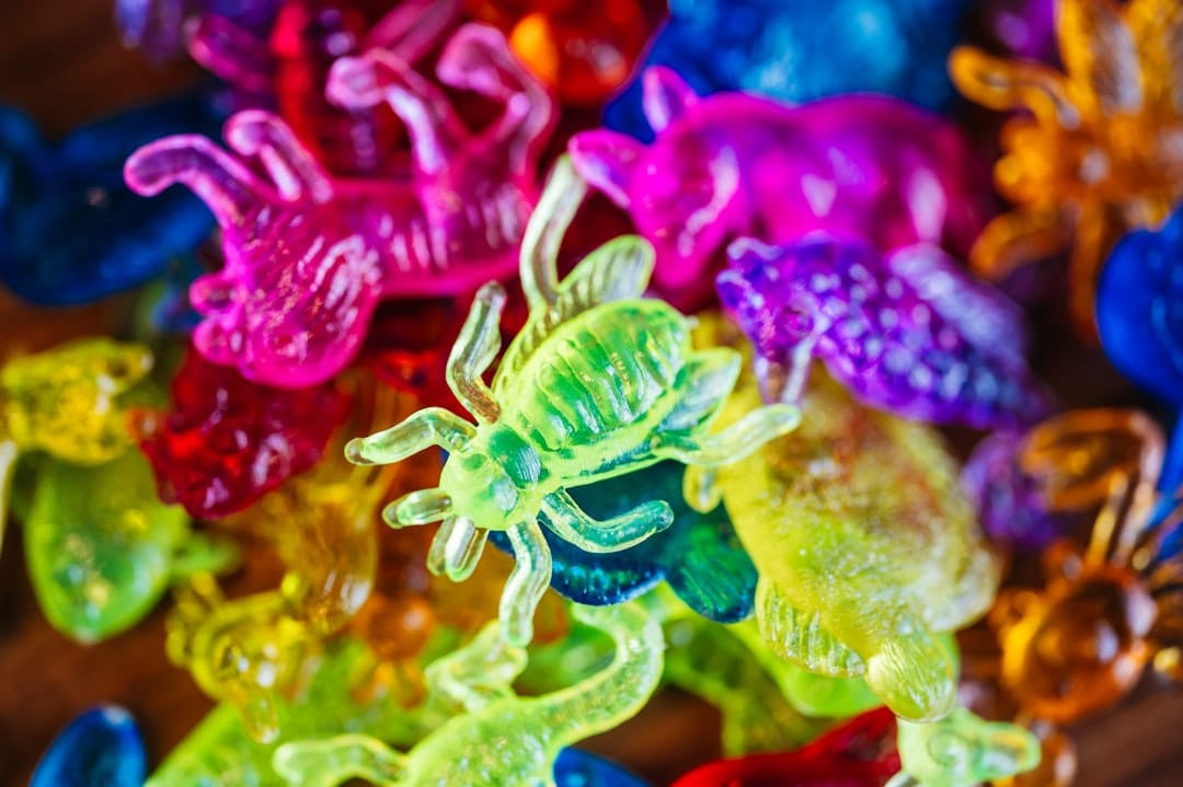 Pile of colourful gummy bears and candies on a table