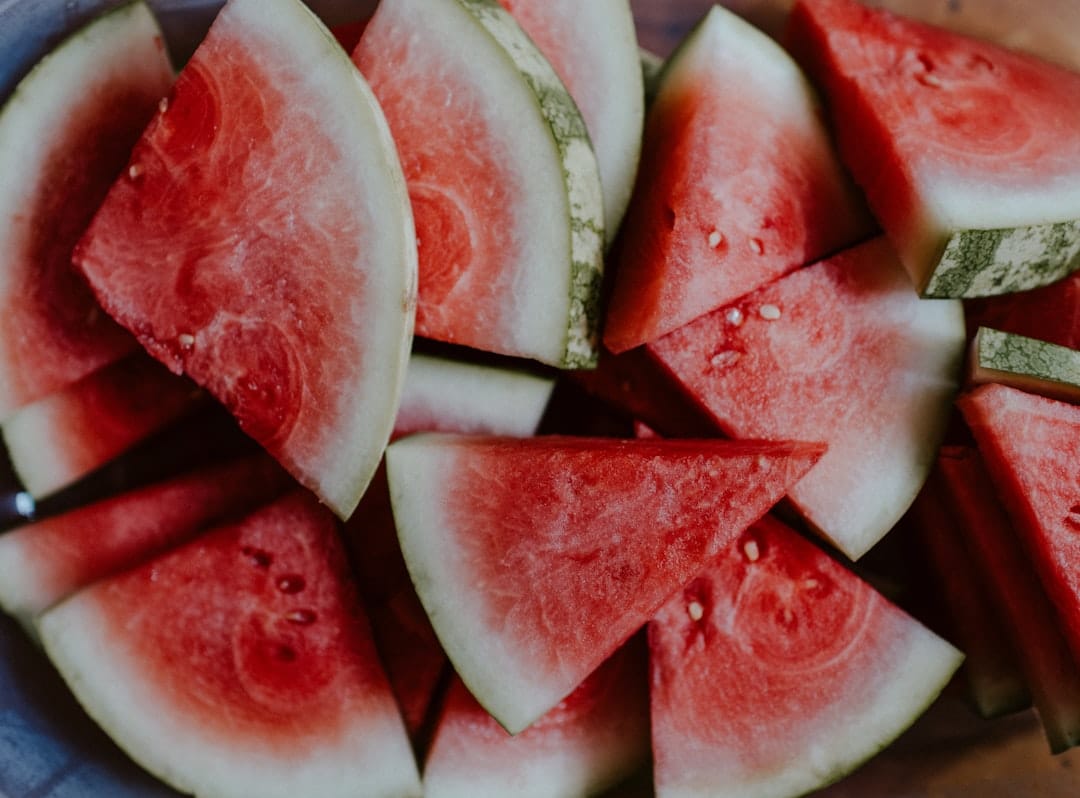 Fresh sliced watermelons with vibrant pink and green colours
