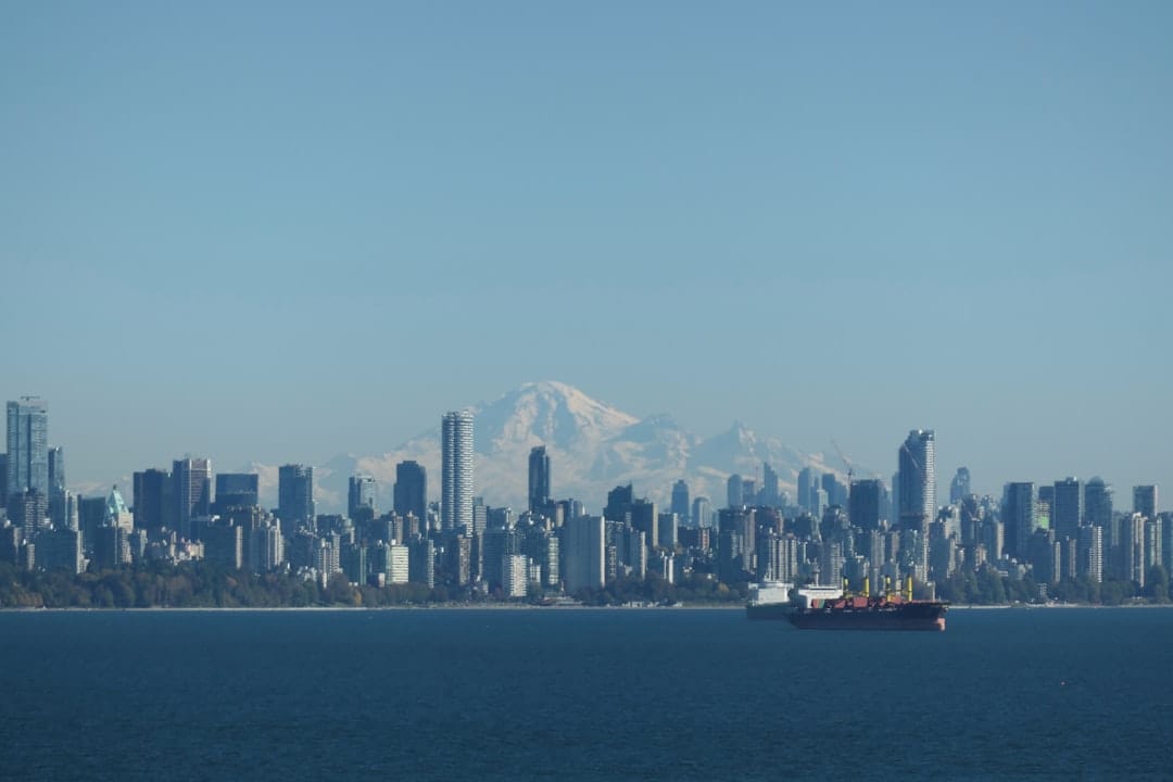 Vancouver skyline backed by snow-capped mountains representing BC craft cannabis culture