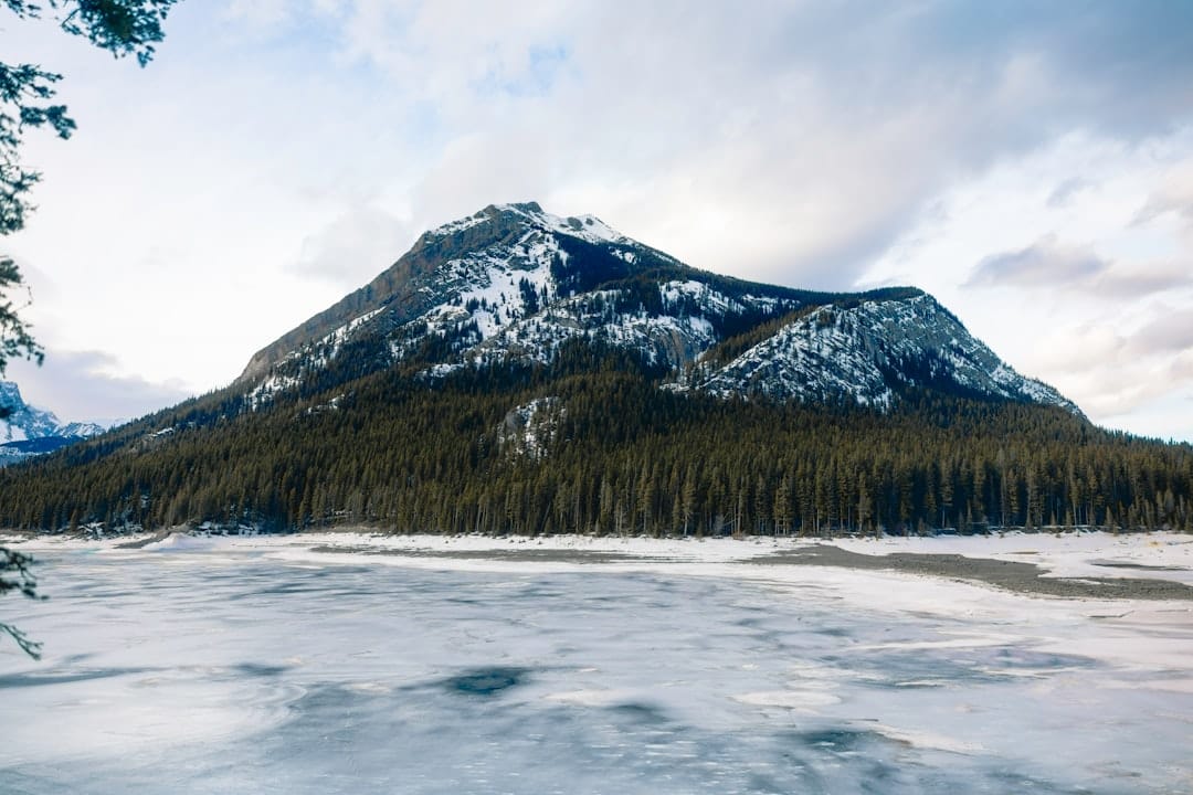 Snow-covered mountain and frozen lake landscape in the Peace Region of British Columbia