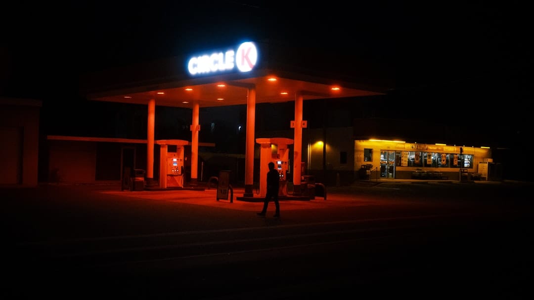 Gas station illuminated at night representing the diesel fuel aroma of All Gas OG cannabis strain