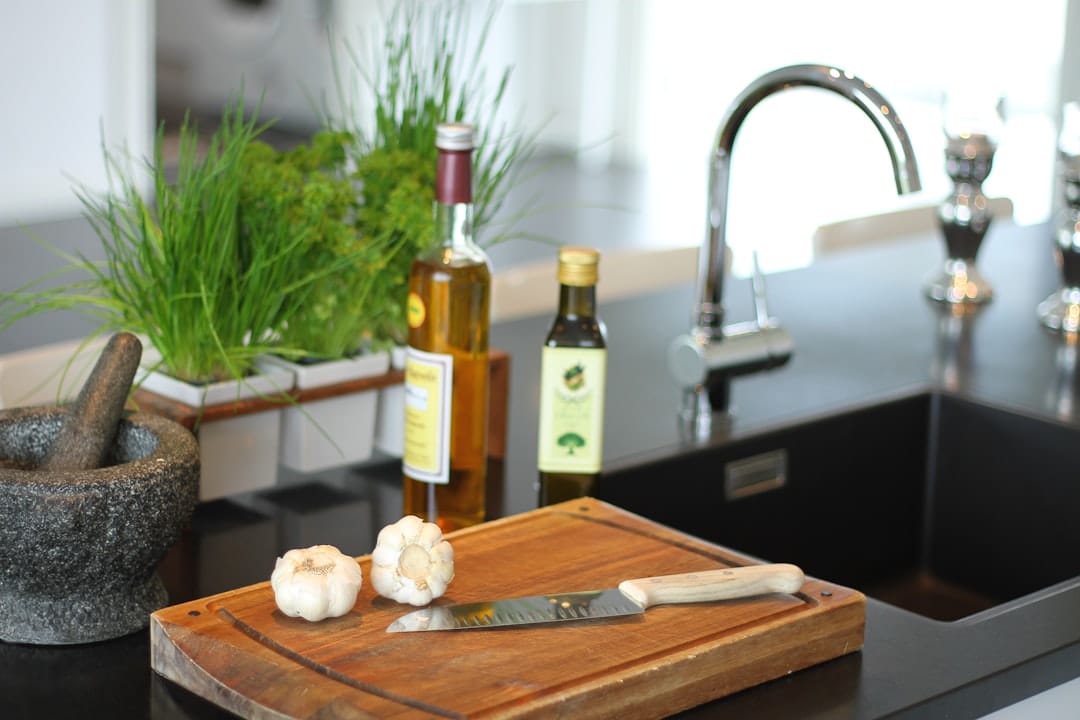 Butter herbs and bread on a wooden chopping board for cannabis cooking