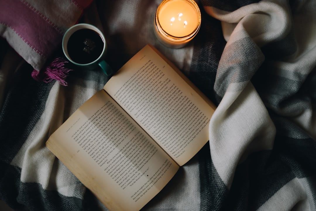 Cozy evening scene with warm blanket and book ideal for indica relaxation