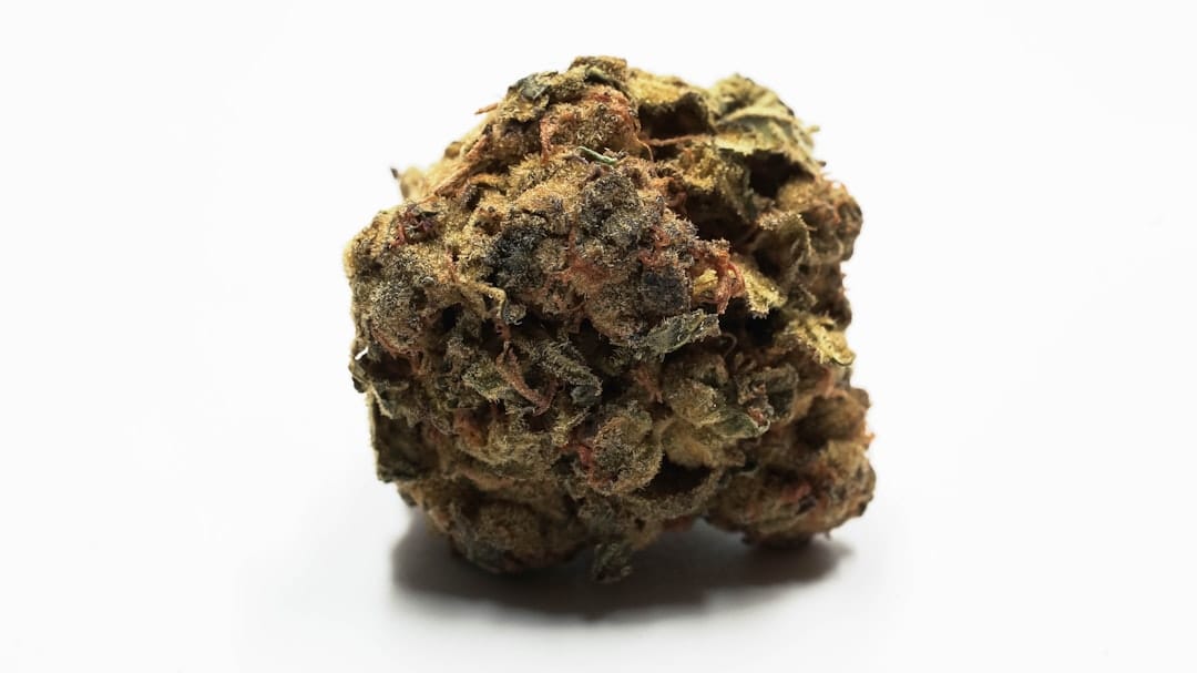 Dense resinous cannabis buds representing AAAA-grade indica flower quality