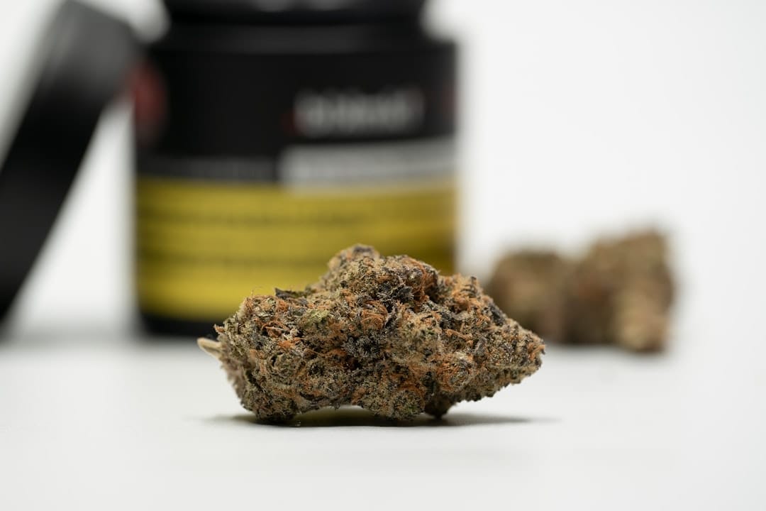 Golden cannabis concentrate on a white surface representing live hash rosin and live resin