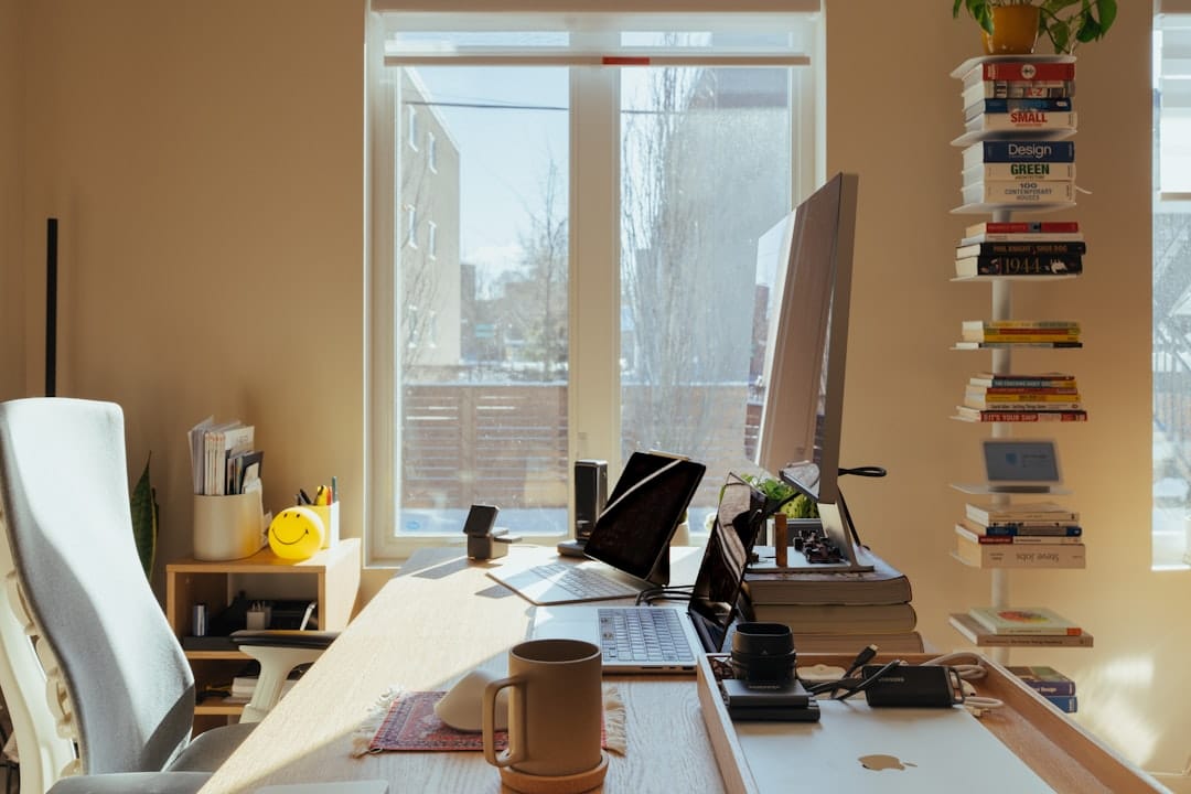 Sunlit home office desk with computer and books representing focused productive sativa effects