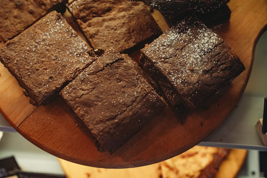 Freshly baked chocolate brownies dusted with powdered sugar for THC infused edibles recipe
