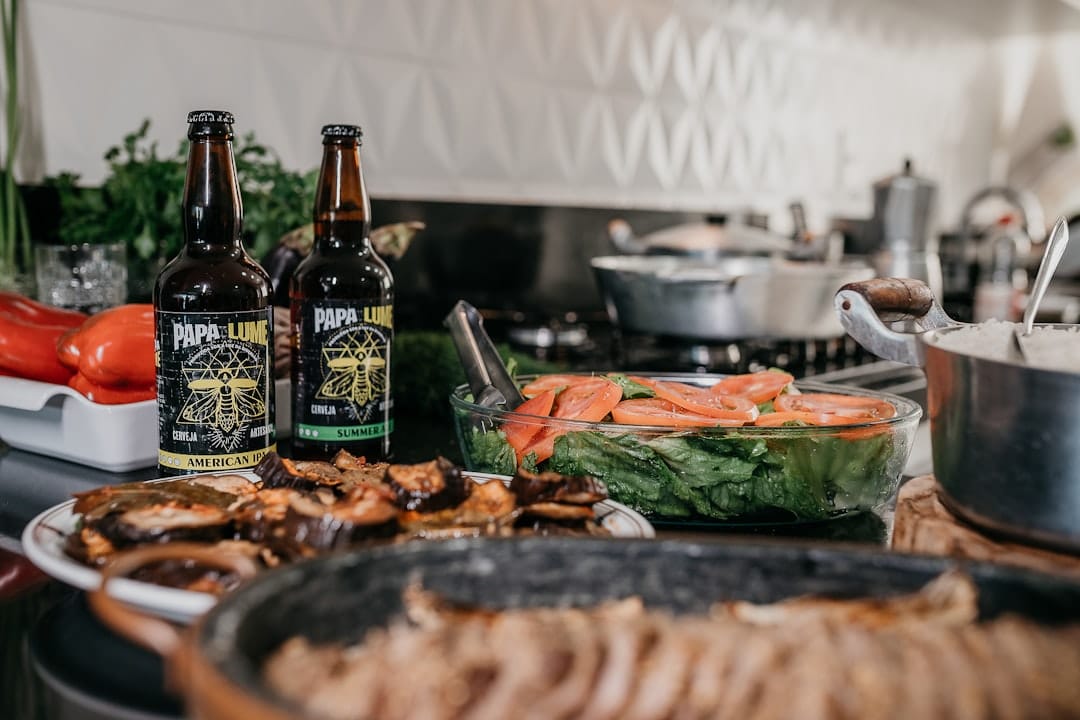 Glass bottle of cannabis infused cooking oil on a wooden table