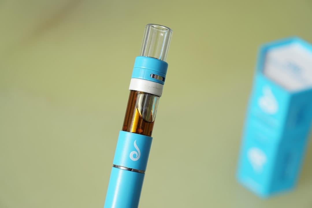 Close-up of a sleek 510 thread THC vape pen cartridge