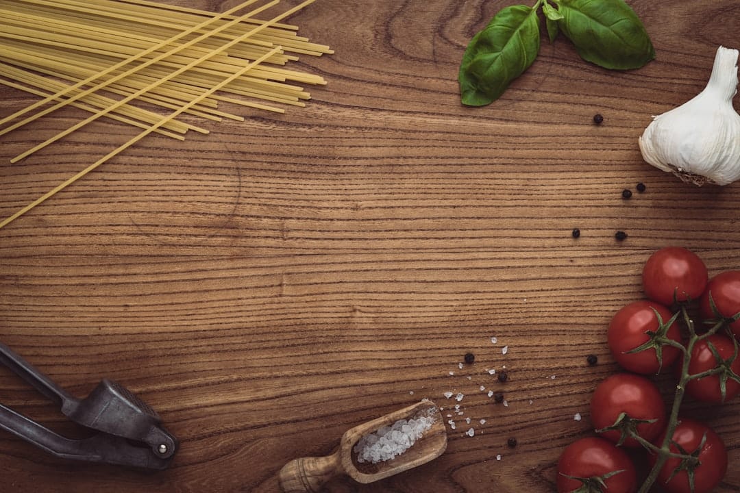 Sliced herb and garlic bread on a rustic wooden chopping board for cannabis infused garlic bread recipe