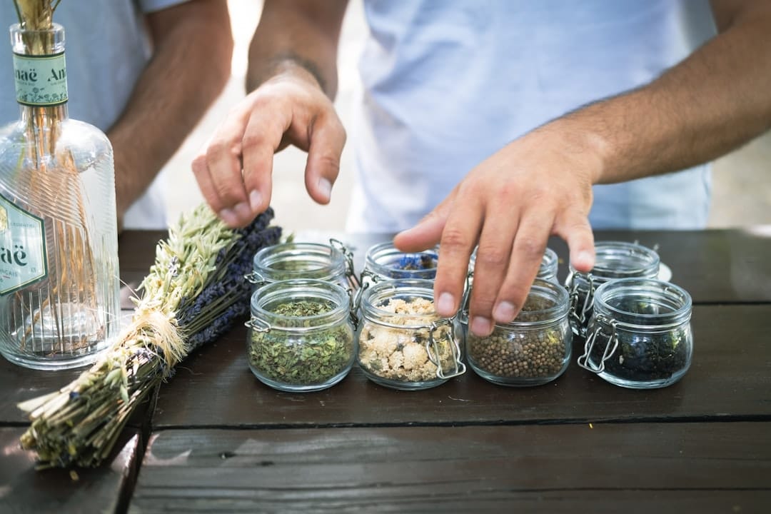 Glass jars filled with dried herbs showing proper cannabis storage technique