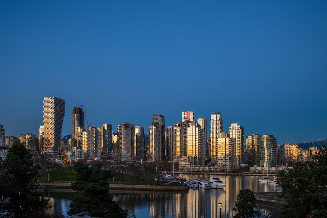 Vancouver BC city skyline at night with water reflection