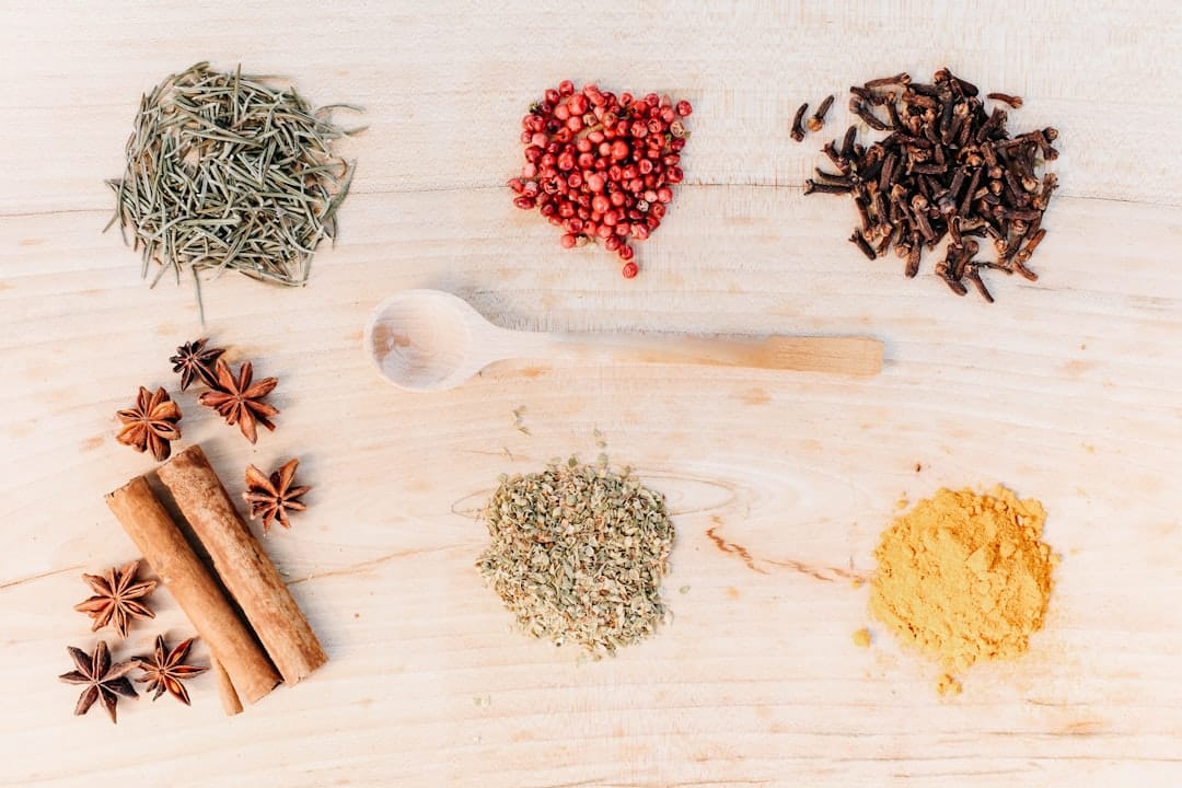 Aromatic herbs and spices on a wooden table representing cannabis terpene profiles