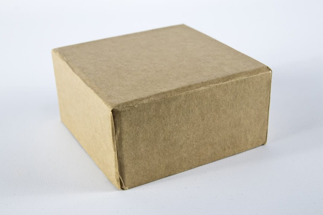 Plain brown cardboard box on a white surface representing discreet cannabis delivery to Liverpool Nova Scotia