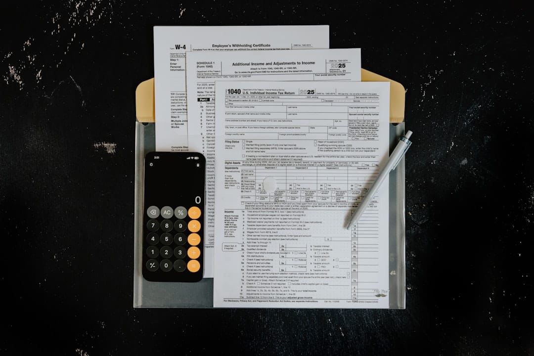 Tax forms with calculator and pen illustrating Canada cannabis excise tax math