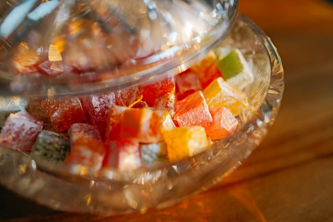 Bowl of assorted CBD gummies on a wooden table representing best CBD gummies Canada