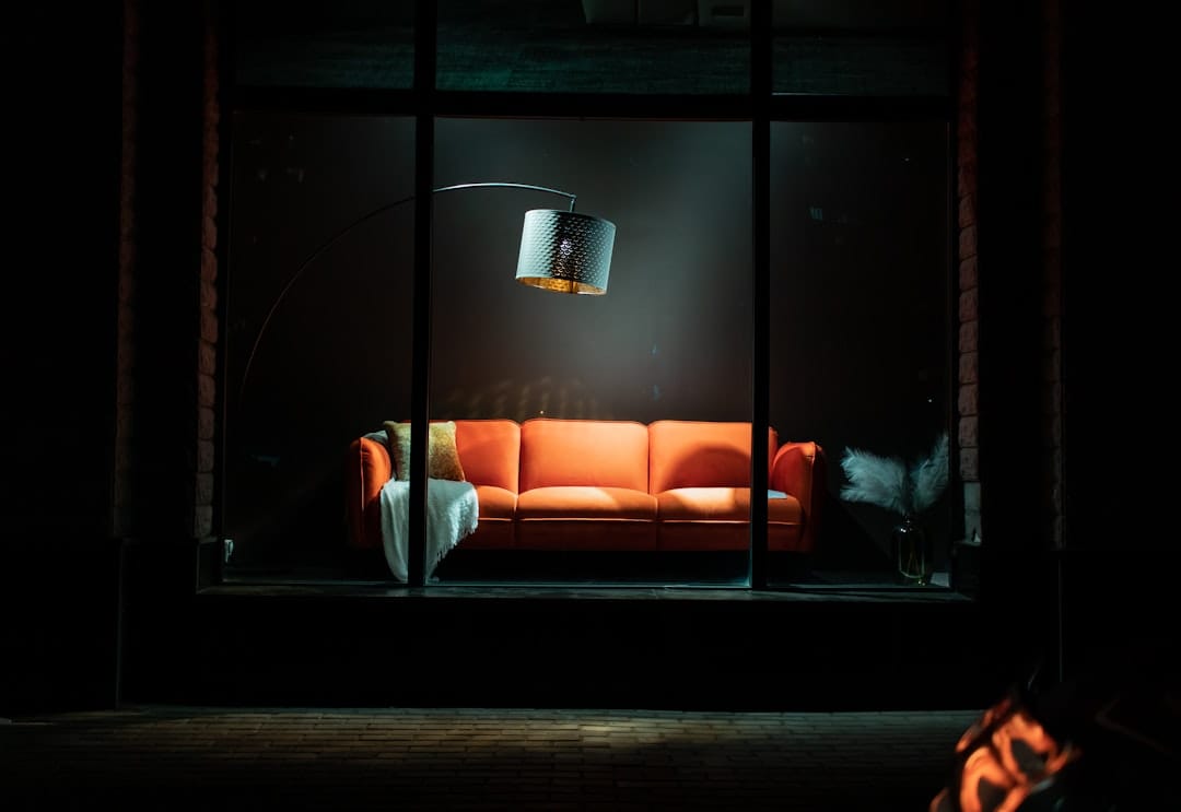 Person relaxing on a couch representing the deep body sedation of Bubba OG indica effects