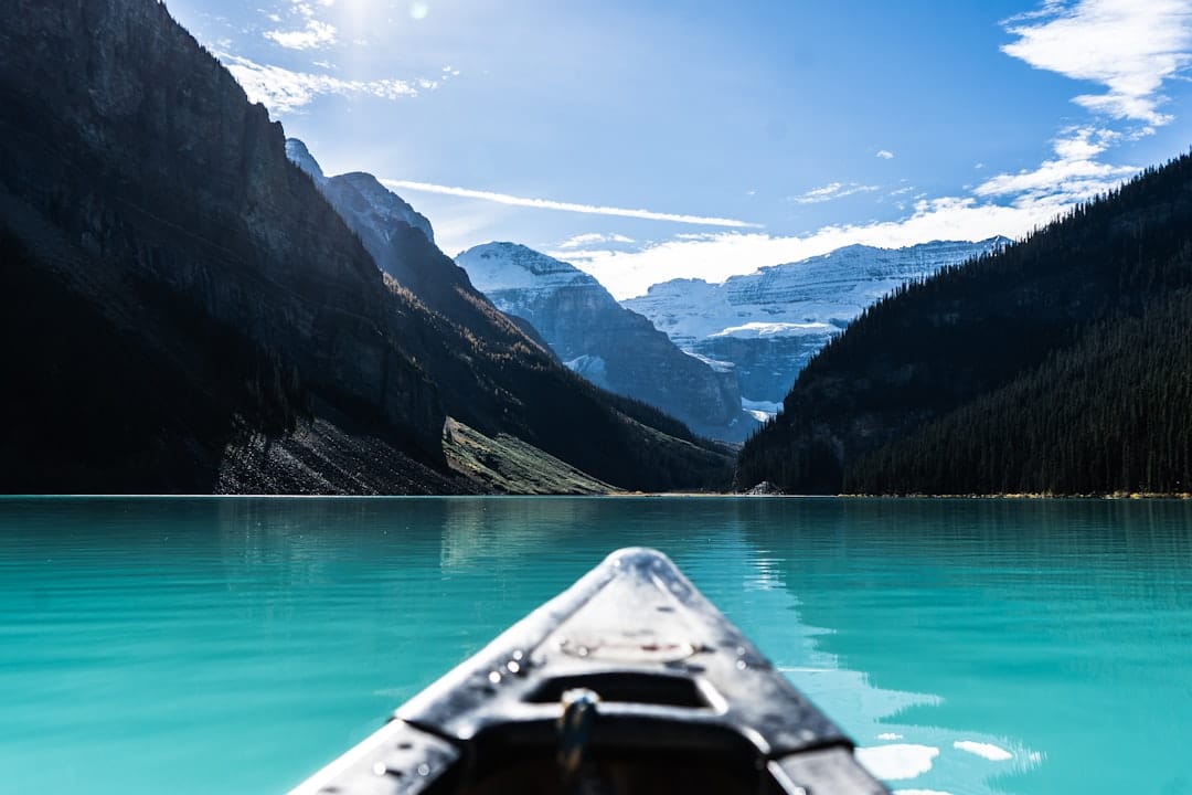 Canoe on turquoise Alberta lake representing Spruce Grove Tri-Region weekend outdoor lifestyle