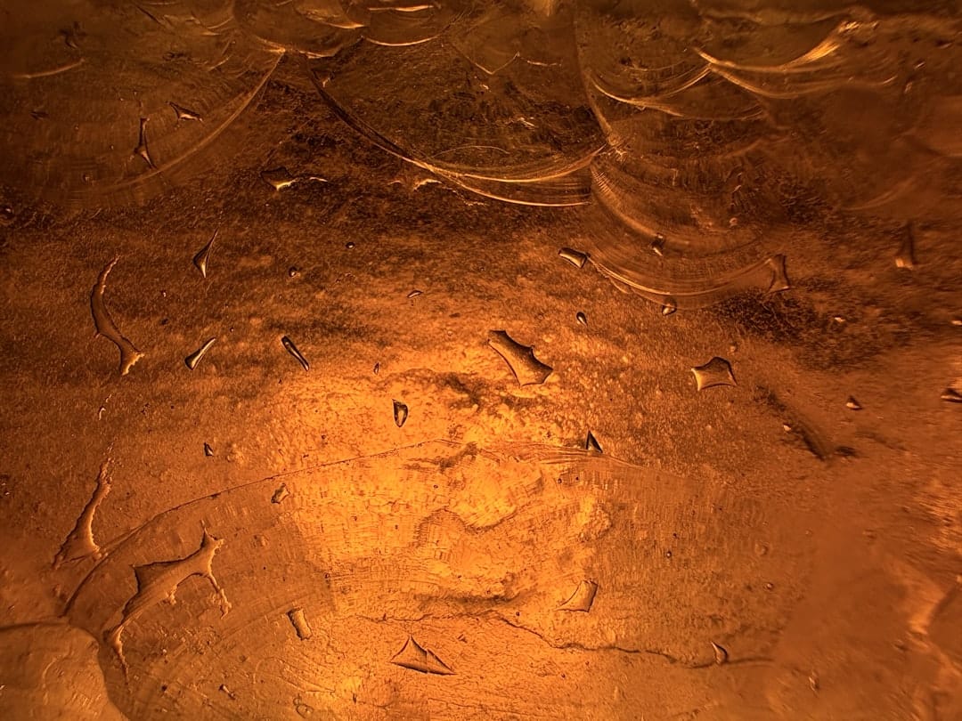 Close-up of golden amber live rosin solventless cannabis concentrate texture
