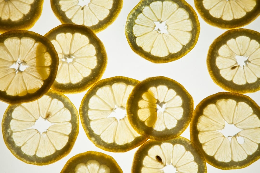 Fresh sliced lemon with water droplets representing limonene terpene
