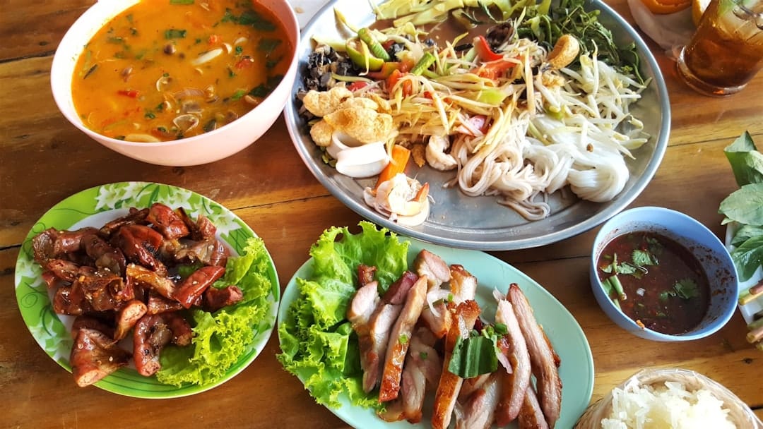 Colourful spread of pasta vegetables and meat dishes for cannabis food pairing