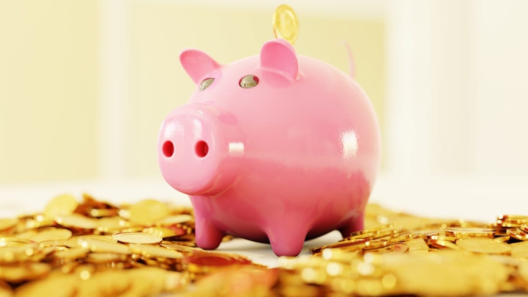 Pink piggy bank on wooden table representing cannabis savings and value
