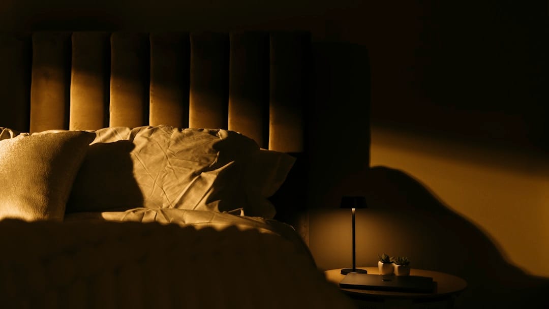Cozy bedroom with soft dim lighting perfect for a restful evening