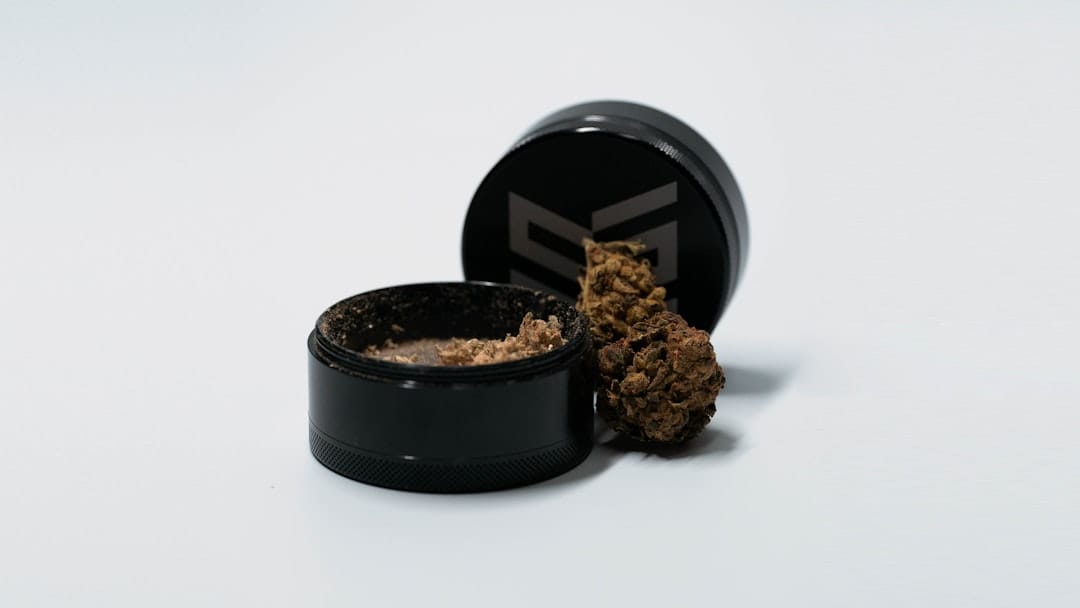 Brown round container resembling a hand-rolled hash ball, evoking Canadian temple ball hash tradition