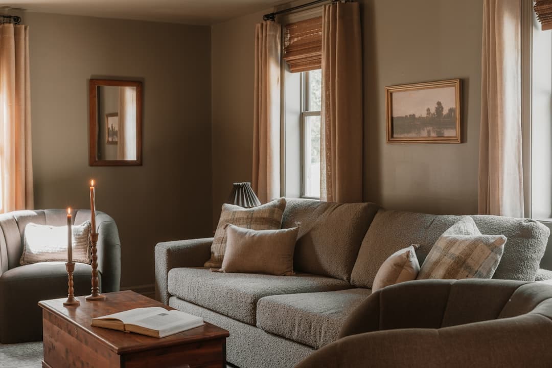 A cozy modern living room with sofa and armchair perfect for a relaxing evening at home in Quispamsis