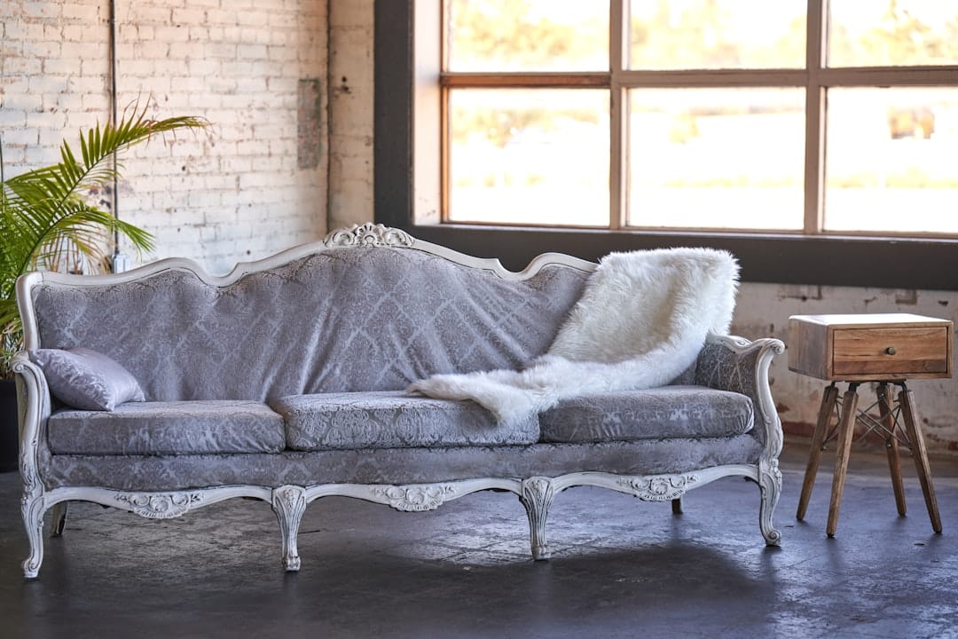 Cozy couch with blanket perfect for a relaxing evening with indica cannabis
