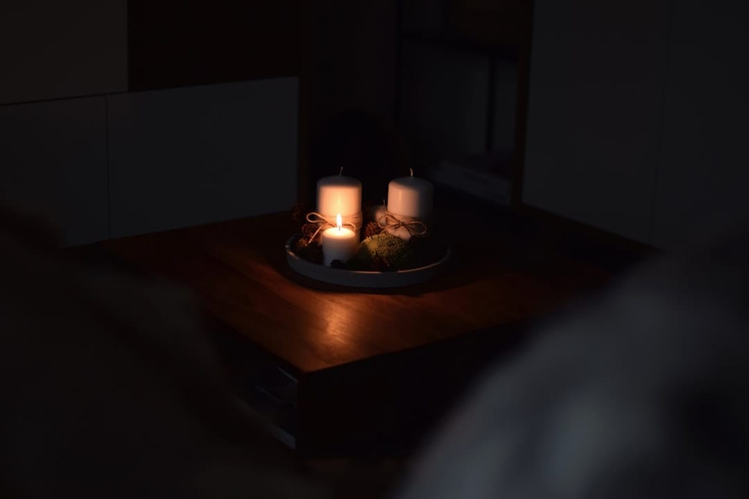 Warm candles creating cozy evening ambiance for relaxation at home