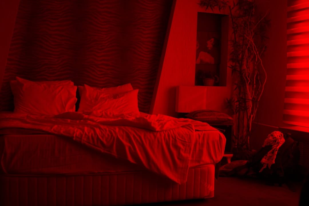 Empty white bed in a peaceful bedroom setting for restful sleep