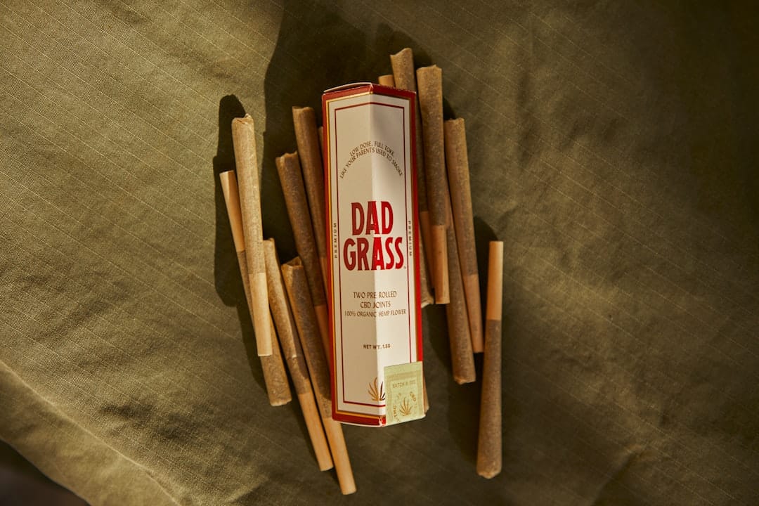 Pre-rolled cannabis joints displayed in branded packaging for delivery
