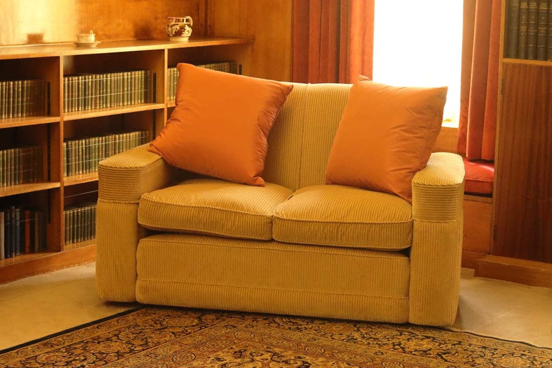 Cozy brown leather sofa perfect for relaxing evening with indica cannabis