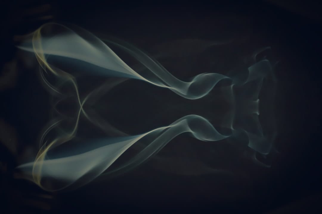 Abstract vapour swirling against a dark background representing cannabis concentrate extraction processes