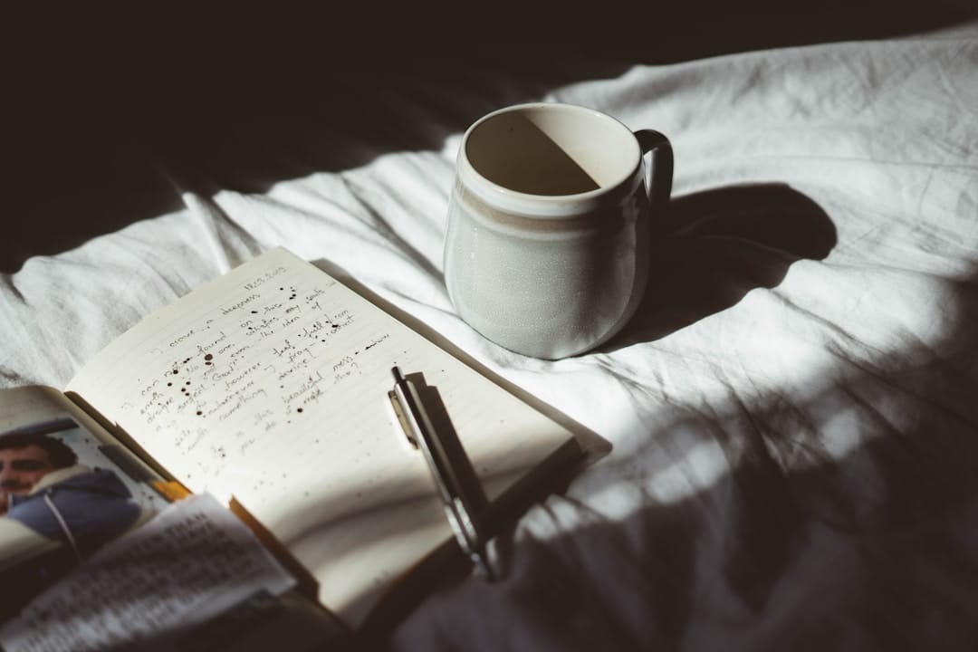 Notebook journal and pen for tracking mushroom microdosing protocol