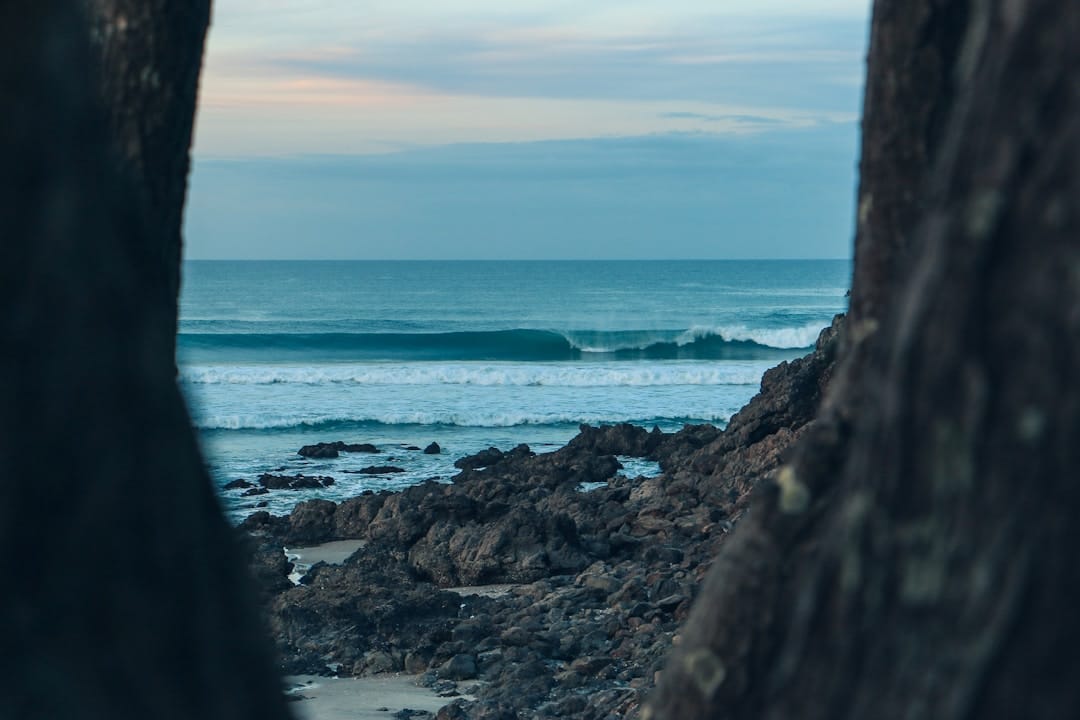 Moody Pacific coast waves and shore representing BC coastal cannabis culture