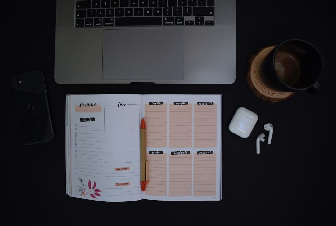 Notebook and cup of coffee on desk for planning THC edibles dosing