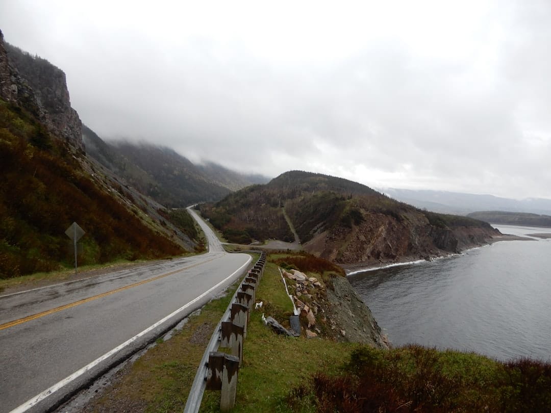 Coastal road along Nova Scotia waterfront resembling the Canso Causeway gateway to Cape Breton