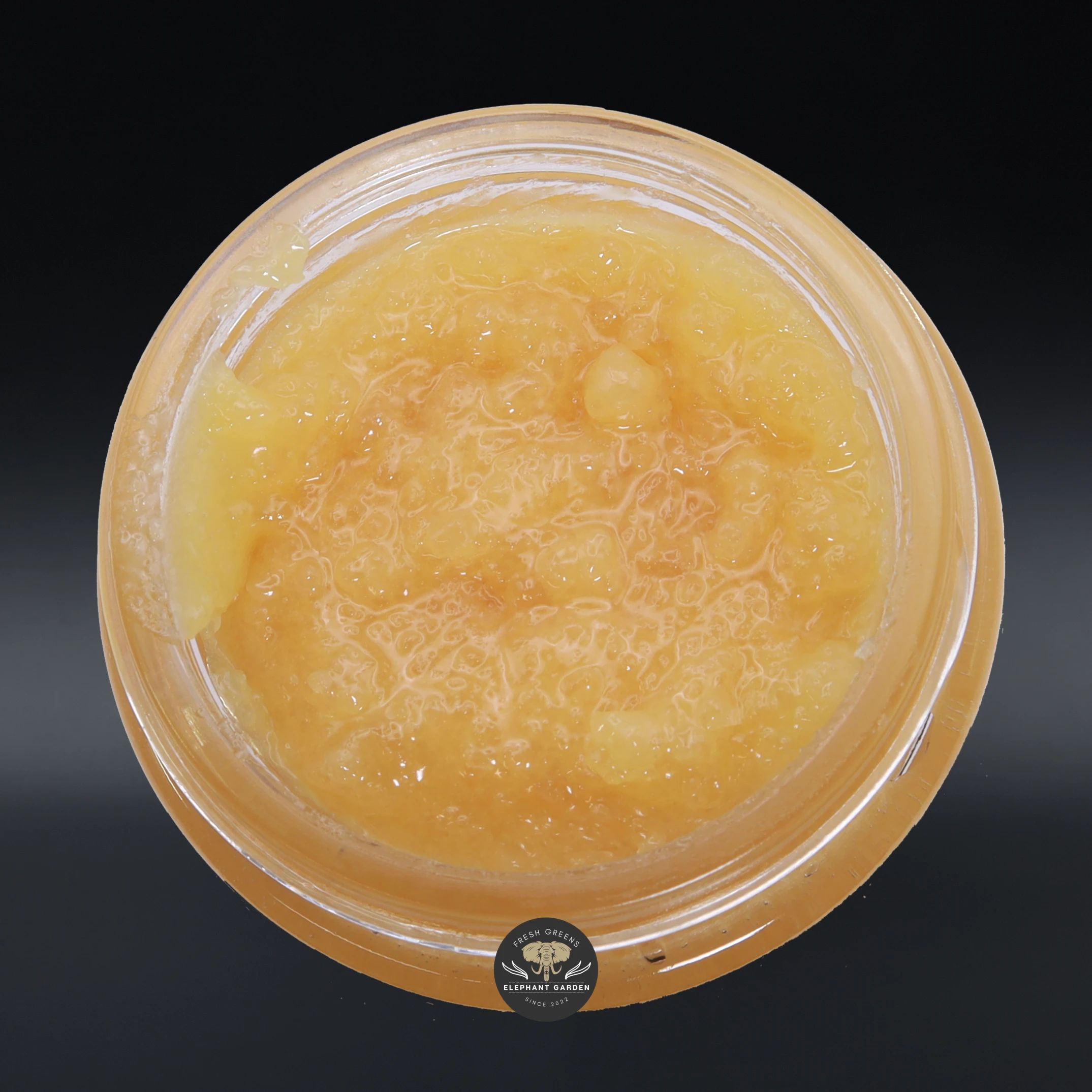 Apple Jack live resin concentrate, amber sauce in a glass jar