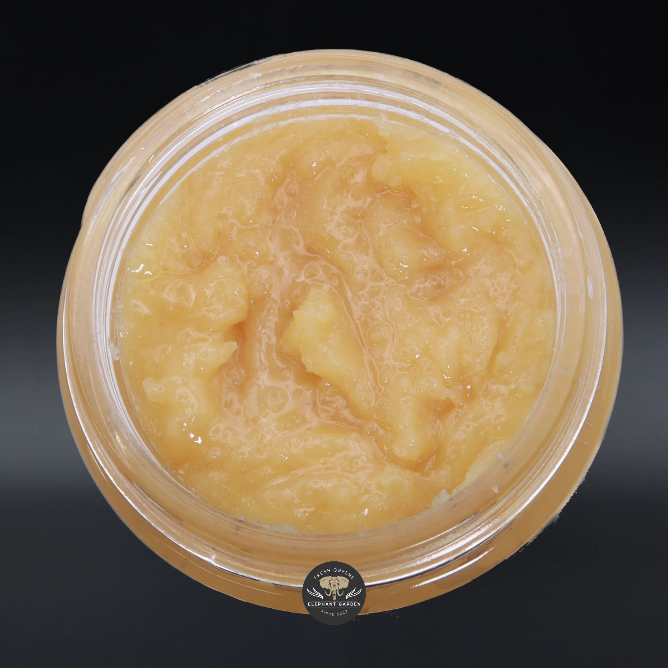 Columbian Gold live resin concentrate, amber sauce in a glass jar