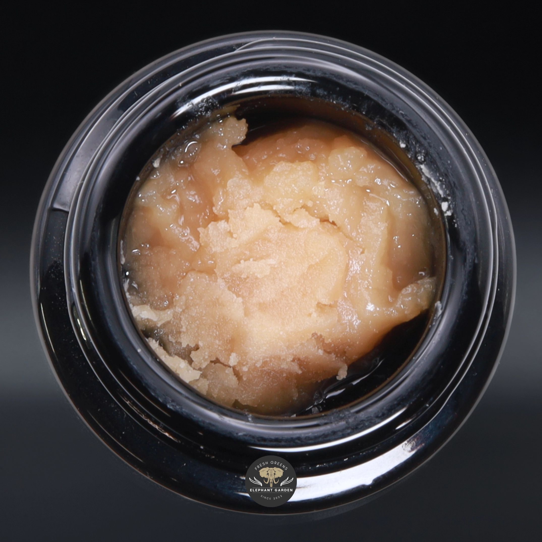 Kiwi Cheesecake live hash rosin, creamy blonde solventless budder in an open glass jar