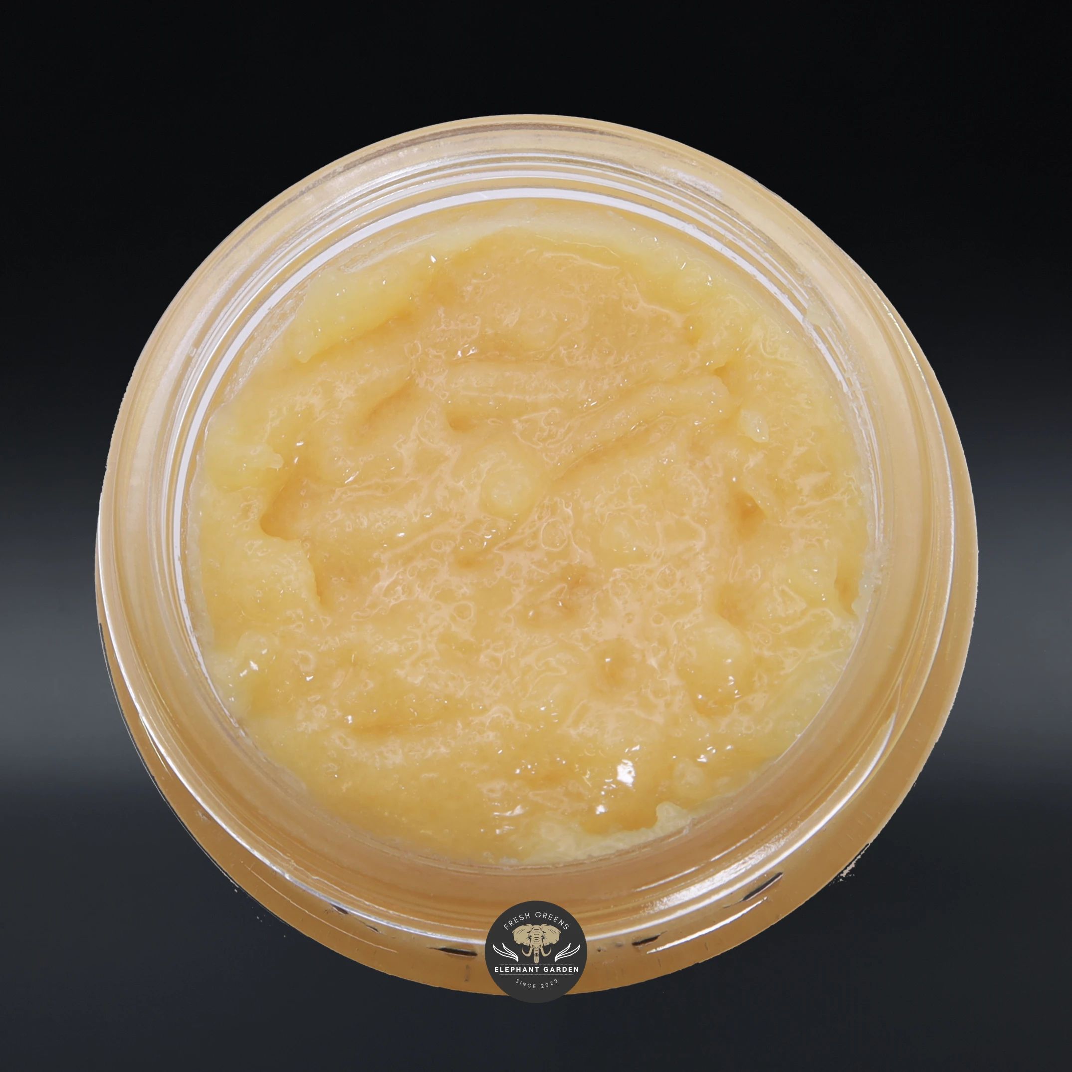 Sugar Cane live resin concentrate, amber sauce in a glass jar