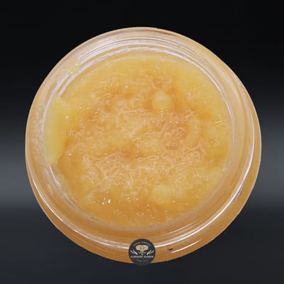 Apple Jack live resin concentrate, amber sauce in a glass jar