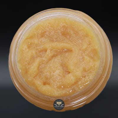 Slurricane live resin concentrate, amber sauce in a glass jar