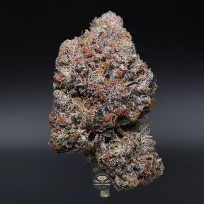 Pine Tar indica flower - close-up product photo of frosty neon green nugs