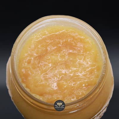 Sherb Cake Live Resin, butter-yellow live resin sauce with a glossy terpene layer in an open glass jar