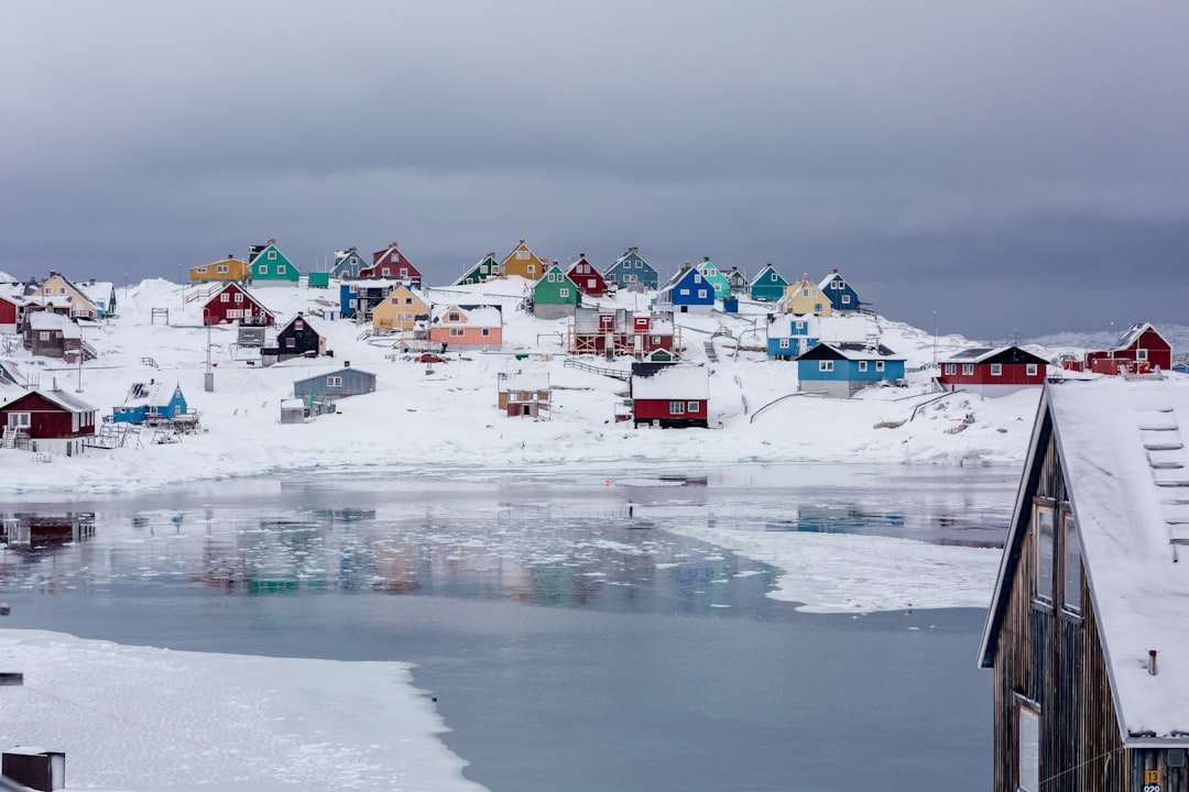 Colourful houses in an Arctic community similar to Iqaluit Nunavut with snow-covered landscape